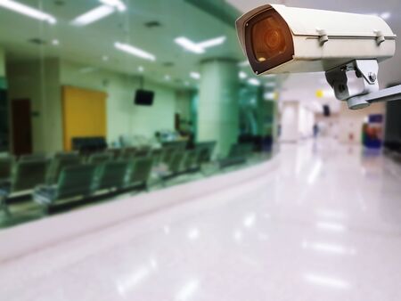 CCTV, security indoor camera system operating with blurred image of hospital background,...