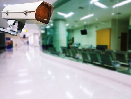 CCTV, security indoor camera system operating with blurred image of hospital background, surveillance security technology conceptの写真素材