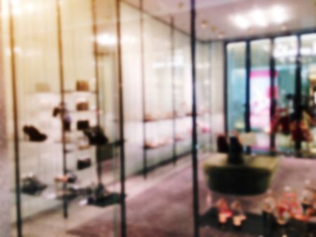 blurred image of showcases fashion shoes display in department store shopping mall, shopping lifestyle conceptの写真素材