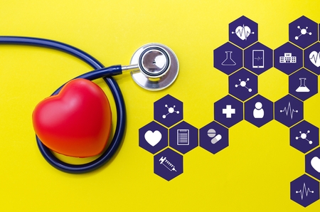 stethoscope and red heart on yellow background with medical icon in hexagon pattern, heart health...