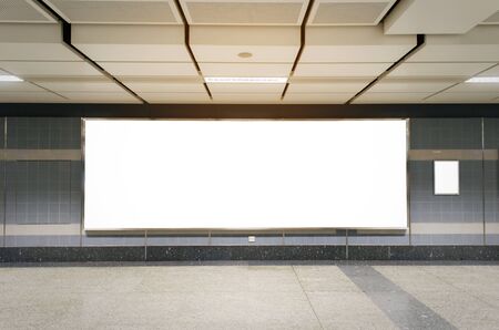 mock up blank billboard with copy space for advertising or media and content marketing at train station, marketing and advertising conceptの写真素材