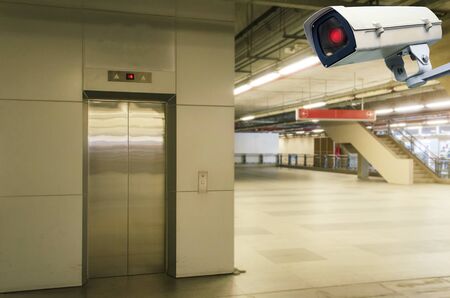 CCTV security indoor camera system operating with subway elevator at train station, transportation, surveillance security, safety technology conceptの写真素材