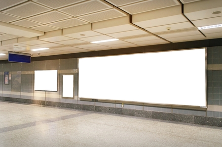 blank advertising billboard with copy space for your text message or media and content in subway train station or airport, information board, mock up banner, marketing and advertising conceptの写真素材