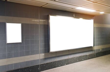 blank advertising billboard with copy space for your text message or media and content in subway train station or airport, information board, mock up banner, marketing and advertising conceptの写真素材