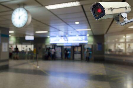 CCTV, security camera system operating with blurred image subway train station background, surveillance security and safety technology conceptの写真素材