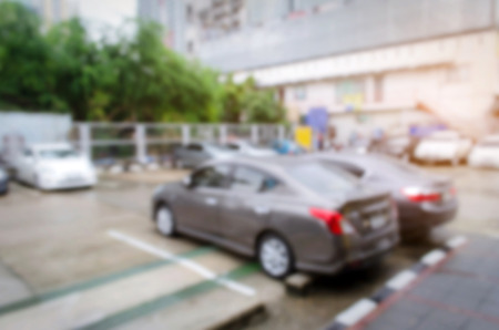 blurred image of car parked on outdoor parking with sunlight effectの写真素材