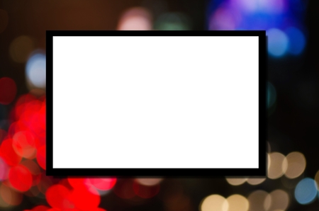 white blank board  or advertising billboard for your text message or media content with abstract night light bokeh background, commercial, marketing and advertising conceptの写真素材