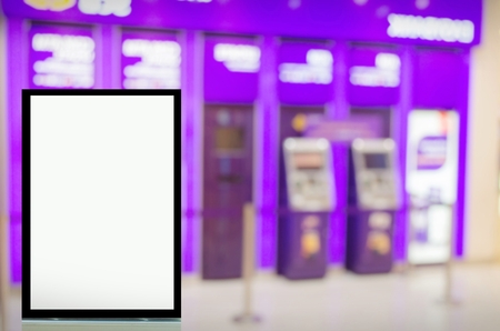advertising billboard or blank showcase light box for your text message or media content in front of ATM (Automated teller machine) banking machine at bank, commercial and marketing conceptの写真素材