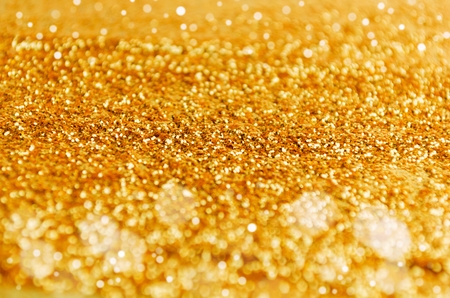 gold color glitter texture and bokeh light for christmas, new year festival abstract backgroundの写真素材