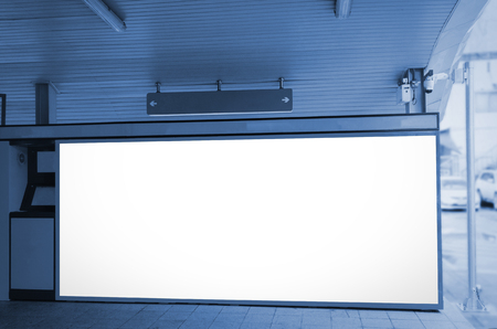 blank advertising billboard or light box at subway train station, blue color tone, copy space for your text message or media content, commercial and marketing conceptの写真素材