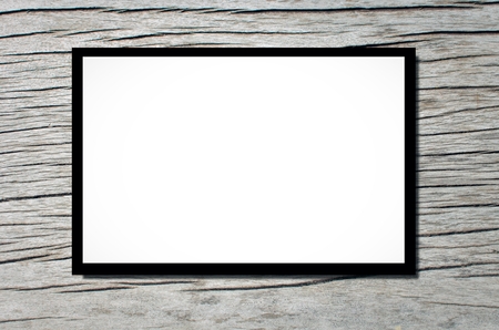 blank advertising billboard or wide screen television on old white or gray wooden texture background, copy space for display of product presentation, commercial and marketing conceptの写真素材