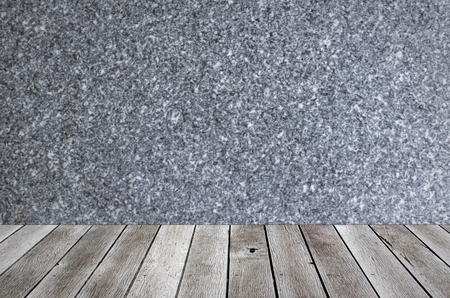 wooden floor terrace or plank desk with marble wall background, copy space for display of product or object presentationの写真素材