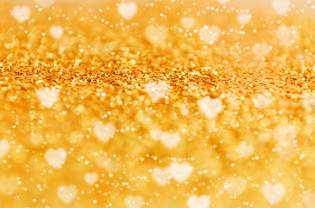 golden glitter texture and heart bokeh light background for holidays, valentine day, christmas and new year festival abstract background, copy space for text or media contentの写真素材