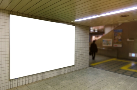 blank advertising billboard or big light box showcase on wall at airport or subway train station, copy space for your text message or media content, advertisement, commercial and marketing conceptの写真素材