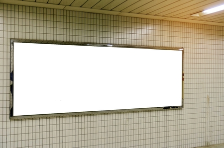 blank advertising billboard or light box showcase on wall at airport or subway train station, copy space for your text message or media content, advertisement, commercial and marketing conceptの写真素材