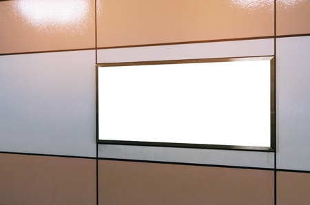 blank advertising billboard or light box showcase on wall at airport or subway train station, copy space for your text message or media content, advertisement, commercial and marketing conceptの写真素材