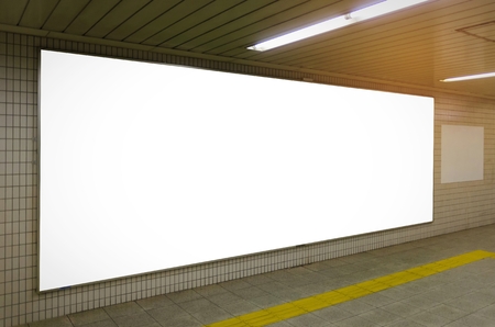 blank advertising billboard or big light box showcase on wall at airport or subway train station, copy space for your text message or media content, advertisement, commercial and marketing conceptの写真素材