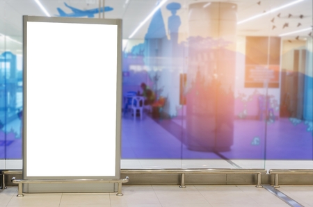 mock up of vertical blank showcase light box or advertising billboard for your text message or media content at waiting zone in terminal at the airport, advertisement, commercial and marketing conceptの写真素材