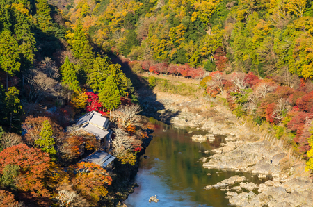top view point of the river and forest in autumn season, beautiful fall colorful at Arashiyama, Kyoto, Japanの写真素材
