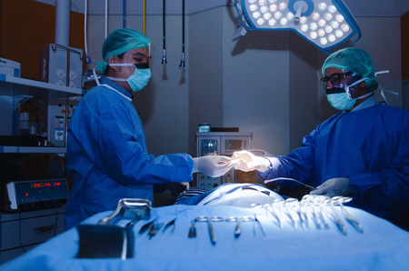 group of Doctor and Assistant surgeons work for rescue patient in operation room at hospital, emergency case, surgery, medical technology, health care cancer and disease treatment conceptの写真素材