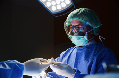 group of Doctor and Assistant surgeons work for rescue patient in operation room at hospital, emergency case, surgery, medical technology, health care cancer and disease treatment conceptの写真素材