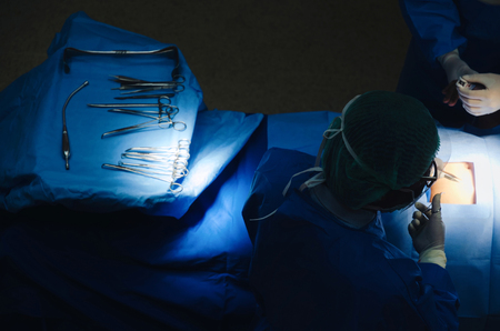 top view of group of Doctor and Assistant surgeons work for rescue patient in operation room at hospital, emergency case, surgery, medical technology, health care cancer and disease treatment conceptの写真素材