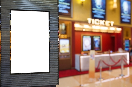 blank showcase billboard or advertising light box for your text message or media content with blurred image of ticket sales counter at movie theater, advertisement, marketing, entertainment conceptの写真素材