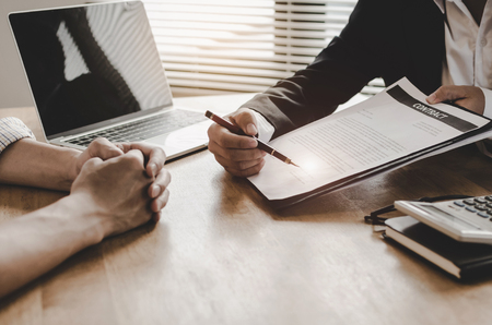 legal consultants, notary or justice lawyer discussing contract document and laptop computer on desk with client customer in courtroom office, business, justice law, insurance, legal service conceptの写真素材