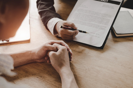 legal consultants, notary or justice lawyer discussing contract document on desk with client customer in courtroom office, business, justice law, insurance, legal service, buy and sell house conceptの写真素材