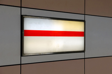 blank advertising billboard on wall with copy space for your text message or media and content in subway train station or airport, information board, banner, marketing and advertising conceptの写真素材