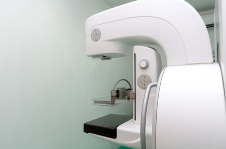 operating room with Mammography X-Ray System Machine in hospital, laboratory, cancer and disease treatment, history patient record report, research medical diagnosis and health care technology conceptの写真素材