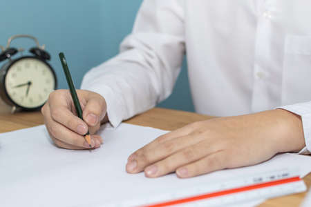 hand interior designer, engineer or architect drawing on blueprint with alarm clock in meeting room...