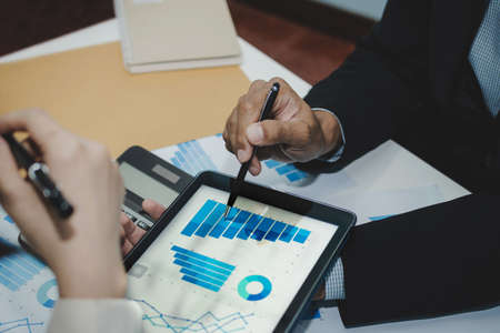 group business people meeting and planning about strategy finance business with digital tablet on...