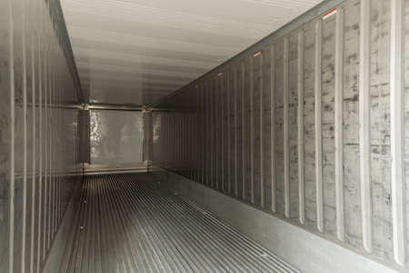 empty interior shipping cargo container for transportation shipping and logistic with copy space at container cargo harbor, industrial, delivery service, logistics import and export business conceptの写真素材