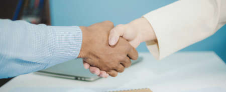 Panoramic banner. Partnership. two business man investor handshake deal with partner after finishing...