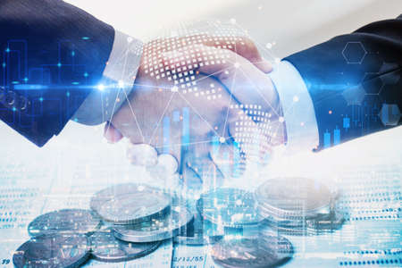 multi exposure business man handshake with effect global world map network link connection and graph chart stock market diagram, digital technology, internet communication, partnership meeting conceptの写真素材