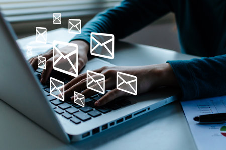 people hand working business finance on laptop computer send email on desk at home office with icon diagram, social network, mail, digital marketing, work from home, connection technology conceptの写真素材
