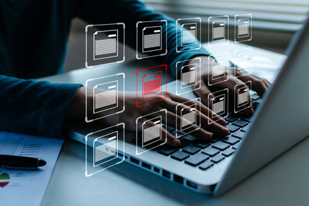 document management system. business hand using laptop computer with virtual graphic icon on desk at home, digital marketing, cloud computing, business finance, internet network technology conceptの写真素材