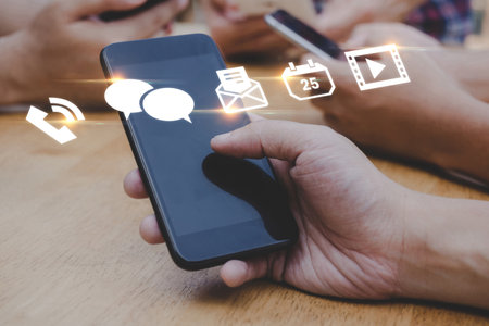 Mobile Application. people hand using mobile smart phone with virtual social media icon diagram, contact us, digital marketing, work from home, business finance, internet network technology conceptの写真素材