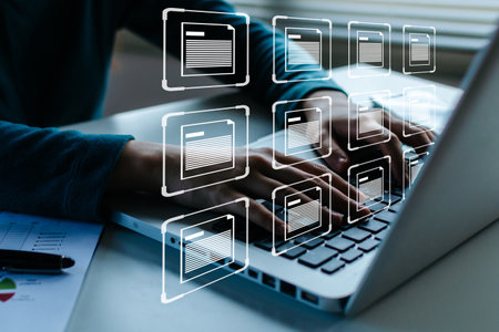 business people hand using laptop computer with virtual database file icon, document management system, digital marketing, cloud computing, business finance, internet, network technology conceptの写真素材