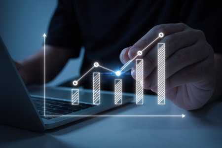 business people using stylus pen with laptop computer and virtual graphic graph chart diagram, stock market, investment trading, digital technology, trading statistics, business strategy conceptの写真素材