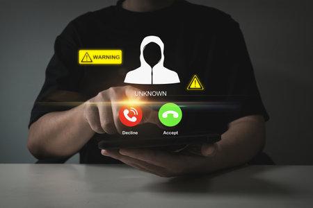 people hand using mobile phone with warning messages icon alert, virus protection software, business finance, malware attack warning, cybersecurity, internet network technology conceptの写真素材