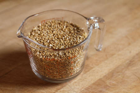 A cup of oat, the basic ingredient for oat milk, a fresh and healthy alternative to cow s milk の写真素材