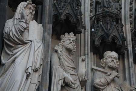 Statues on the front of the Cathedral in Cologne, Germanyの写真素材