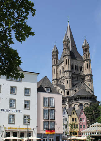 Church and german flag near the river in Cologne, Germanyの写真素材