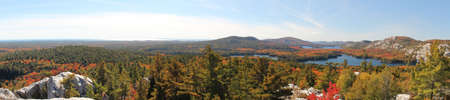 Panoramic view of the lakes, rocky hills and colourful forest at Killarney Provincial Park, Ontario, Canada  This photo is made attaching together various photosの写真素材