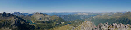 Panoramic view of lake Colombo basin and dam on the Bergamo Alps, northern Italyの写真素材