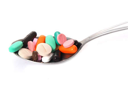 Various pills on the spoonの写真素材