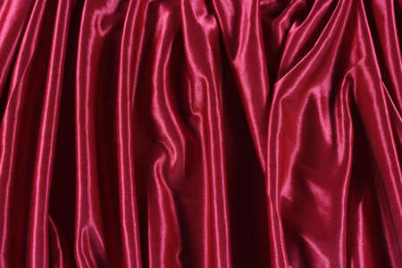 shiny red satin fabric backgroundの写真素材