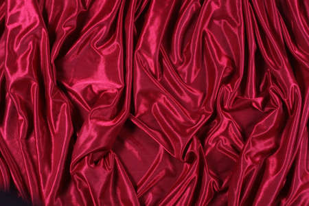 shiny red satin fabric backgroundの写真素材